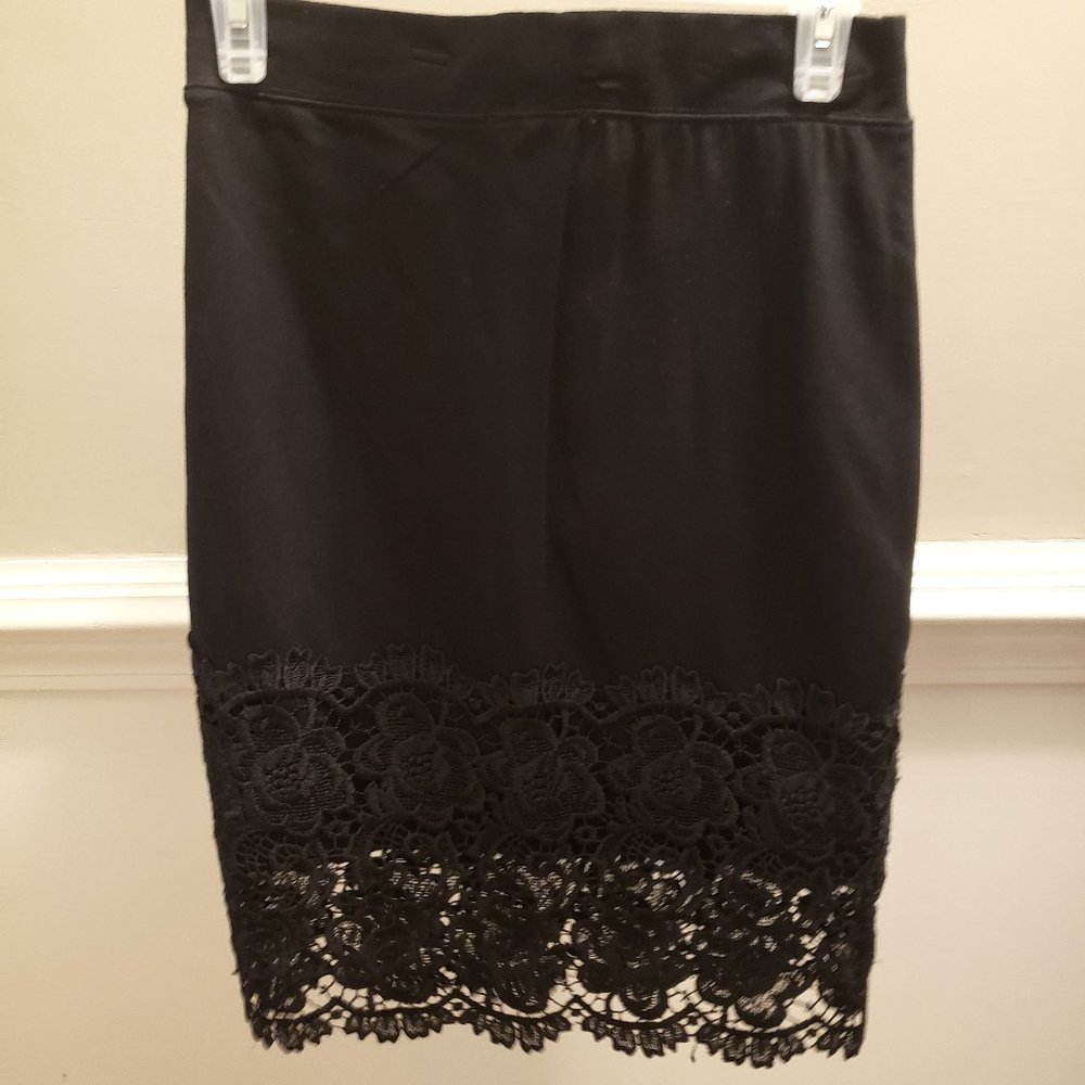 Silky Black skirt with lace detail. Upholds really well!